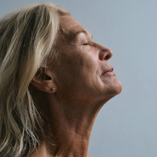 An older woman's profile with a clean face