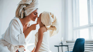 mother and daughter in bathrobes 