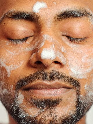 Man's face with foaming cleanser